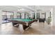 Recreation space featuring a pool table, comfortable seating, and natural light from sliding glass doors at 777 N Washington St # 304, Denver, CO 80203