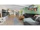Cozy open-concept living space with living room, dining area and kitchen, with wood floors at 777 N Washington St # 304, Denver, CO 80203