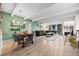 Cozy living room with hardwood floors, sleek sofa, fireplace and an open dining area with wood table at 777 N Washington St # 304, Denver, CO 80203