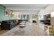 Comfortable living room with sleek sofa, fireplace, large TV and walkout balcony at 777 N Washington St # 304, Denver, CO 80203