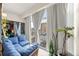 Bright sunroom features big windows, comfortable furniture, a plant, and views of the city at 777 N Washington St # 304, Denver, CO 80203