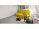 Comfortable room featuring a yellow sofa bed, closet space and a sunflower rug on the gray carpet at 777 N Washington St # 304, Denver, CO 80203