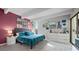 Spacious main bedroom with a colorful accent wall, natural light, and stylish decor at 777 N Washington St # 304, Denver, CO 80203