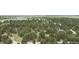 Expansive aerial view of home nestled among mature trees in a serene, wooded setting at 33844 Oriole Ct, Elizabeth, CO 80107