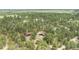 Scenic aerial view of a charming home surrounded by a lush, green tree landscape at 33844 Oriole Ct, Elizabeth, CO 80107
