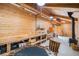 Versatile barn interior featuring work area, table, and wood-burning stove at 33844 Oriole Ct, Elizabeth, CO 80107