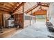 Well-lit barn interior featuring horse stalls and ample storage space at 33844 Oriole Ct, Elizabeth, CO 80107