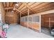 Spacious barn interior with horse stalls and wood beamed vaulted ceiling at 33844 Oriole Ct, Elizabeth, CO 80107