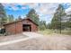 Well-maintained barn with ample space, sliding doors, and a charming exterior at 33844 Oriole Ct, Elizabeth, CO 80107