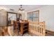 Rustic dining room with a wooden table, chairs, and a unique light fixture creating a warm and inviting atmosphere at 33844 Oriole Ct, Elizabeth, CO 80107