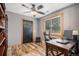 Functional home office with a wooden desk, comfortable chair, and a window for natural light at 33844 Oriole Ct, Elizabeth, CO 80107