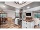Spacious kitchen featuring white cabinets and stainless steel appliances at 33844 Oriole Ct, Elizabeth, CO 80107