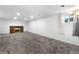 A finished basement with recessed lighting and a brick fireplace provides a cozy and inviting atmosphere at 6336 W 71St Pl, Arvada, CO 80003