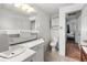 Bathroom featuring updated cabinet and tile flooring plus access to a bedroom at 6336 W 71St Pl, Arvada, CO 80003