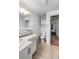 Bathroom with vanity storage and updated tile flooring at 6336 W 71St Pl, Arvada, CO 80003