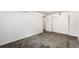 Minimalist bedroom featuring gray carpet, white walls, and a closet provides a versatile living space at 6336 W 71St Pl, Arvada, CO 80003