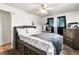 Charming bedroom featuring a built-in bed with drawers, a ceiling fan, and rustic wood accents at 6336 W 71St Pl, Arvada, CO 80003