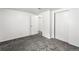 Neutral bedroom with light gray carpeting, white walls, closet, and open doorway offers a blank canvas at 6336 W 71St Pl, Arvada, CO 80003