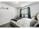 Well-lit bedroom with gray carpeting and natural lighting from windows at 6336 W 71St Pl, Arvada, CO 80003