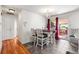 Dining area with tile floors, chandelier, and sliding glass doors to the backyard at 6336 W 71St Pl, Arvada, CO 80003