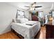 Comfortable main bedroom with wood floors, ceiling fan and television at 6336 W 71St Pl, Arvada, CO 80003