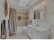 The bathroom features tiled floors, a tub with a shower and double sinks at 1540 Fawnwood Rd, Monument, CO 80132
