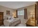 This bedroom is cozy and inviting with a large window and closet for storage at 1540 Fawnwood Rd, Monument, CO 80132