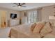 Comfortable bedroom with sliding glass door, ensuite bathroom, and serene natural light at 1540 Fawnwood Rd, Monument, CO 80132