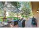 Spacious wood deck with comfortable seating, fire pit table, and grill at 1540 Fawnwood Rd, Monument, CO 80132
