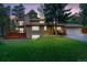 Charming two-story home featuring a well-manicured lawn and a spacious deck, perfect for outdoor entertaining at 1540 Fawnwood Rd, Monument, CO 80132
