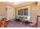 Cozy front porch with seating, offering a welcoming entrance to this charming home at 1540 Fawnwood Rd, Monument, CO 80132
