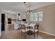 Spacious kitchen and eat-in area with tile floors, pendant lighting, and natural light at 1540 Fawnwood Rd, Monument, CO 80132