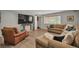 Spacious living room with hardwood floors, a large window, and plush seating at 1540 Fawnwood Rd, Monument, CO 80132