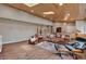 Relaxing living room with hardwood floors, comfortable leather seating, and abundant natural light at 1540 Fawnwood Rd, Monument, CO 80132