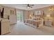 Serene main bedroom features plush carpeting, balcony access, and decorative lighting fixtures at 1540 Fawnwood Rd, Monument, CO 80132