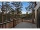 A private balcony offers tree-lined views of the surrounding landscape at 30343 Inverness Ln, Evergreen, CO 80439