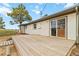 Wooden back deck with sliding glass door, ideal for outdoor entertaining at 1604 Lisbon Dr, Parker, CO 80138