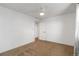 A vacant bedroom featuring neutral carpet and a ceiling fan at 1604 Lisbon Dr, Parker, CO 80138