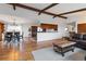 Open floor plan featuring hardwood floors, a dining area, and a kitchen at 1604 Lisbon Dr, Parker, CO 80138