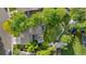 Aerial view of the property highlighting the lush landscaping, outdoor living spaces, and mature trees at 3235 E Easter Pl, Centennial, CO 80122