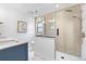 Bright bathroom showcasing a glass walk-in shower and modern vanity with unique sink at 3235 E Easter Pl, Centennial, CO 80122