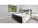 Cozy bedroom with large window, plush bedding, and neutral color palette at 3235 E Easter Pl, Centennial, CO 80122