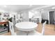 Inviting dining area with a large table, comfortable seating, and access to the living room at 3235 E Easter Pl, Centennial, CO 80122