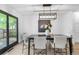 Contemporary dining room with modern light fixture, stylish table setting, and backyard views at 3235 E Easter Pl, Centennial, CO 80122