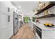 Modern kitchen with stainless steel appliances, subway tile backsplash, and hardwood floors at 3235 E Easter Pl, Centennial, CO 80122