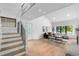 Airy living room with high ceilings, hardwood floors, a staircase, and ample natural light at 3235 E Easter Pl, Centennial, CO 80122