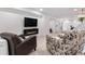 Cozy living room with electric fireplace, large TV, and comfortable seating at 3235 E Easter Pl, Centennial, CO 80122