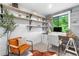 Contemporary office space with custom shelves, stylish decor, and lots of natural light at 3235 E Easter Pl, Centennial, CO 80122