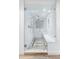 Modern glass-enclosed shower with dual shower heads, white subway tile, and a built-in bench at 3235 E Easter Pl, Centennial, CO 80122