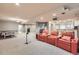 Finished basement featuring a home theater setup with plush seating and a ping pong table at 714 Skywalker Pt, Lafayette, CO 80026